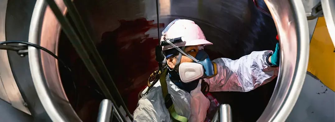 A masked safety worker
